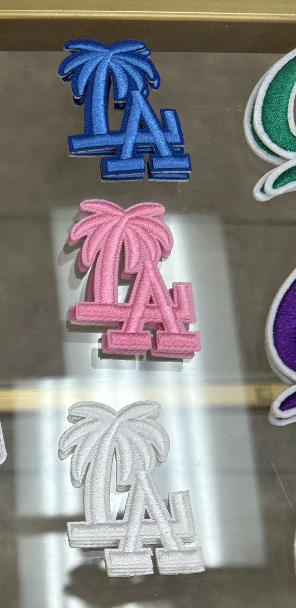 LA palm tree patches in blue, pink, and white